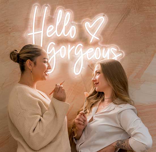 Darla and Bria with Hello Gorgeous sign